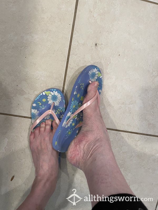 Adorable Flower Print On Light Blue Background Flip Flops Used While Housecleaning