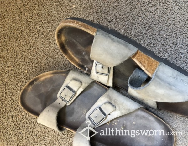 Dirty Smelly Old Birkenstock Sandals With Deep And Dark Foot And Toe Insole Imprint. Big Feet
