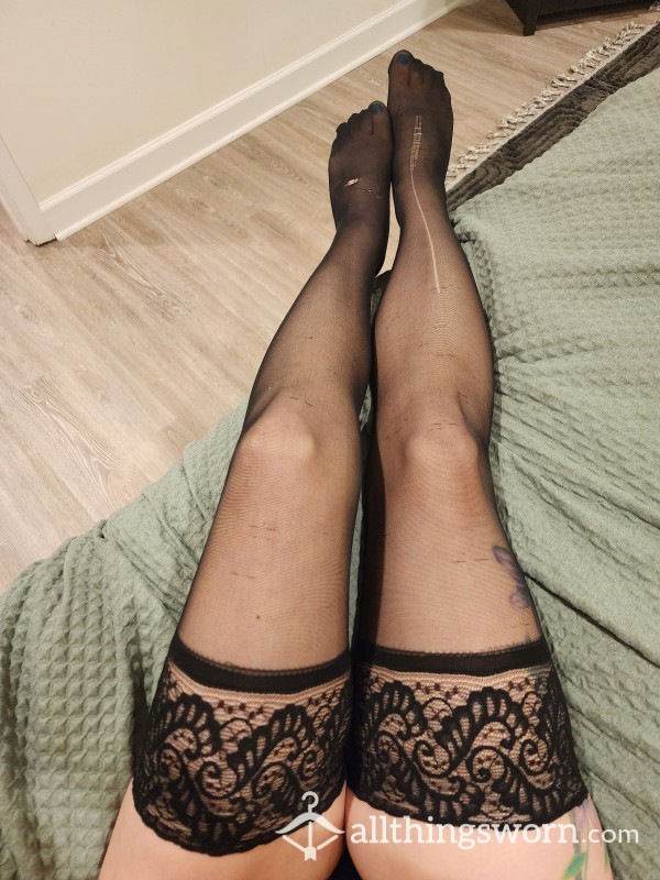 Black Stockings With Lace Garters. Torn, Snagged And With Runs.
