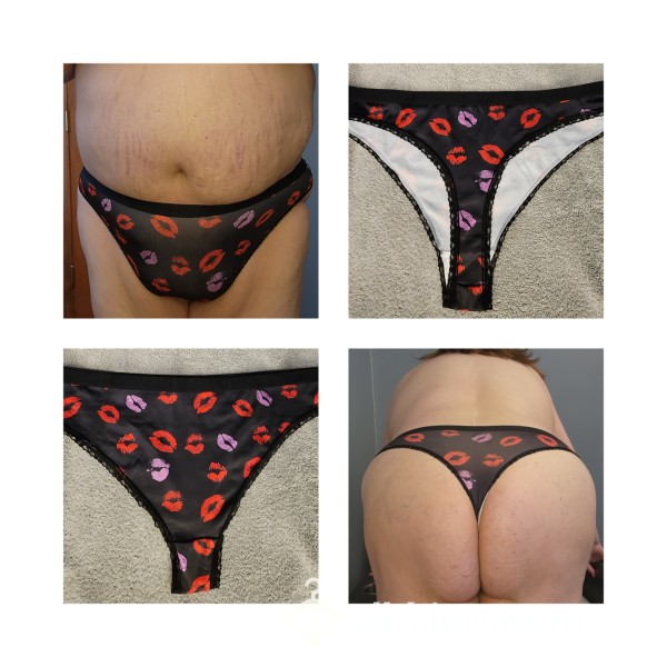 BLACK THONG WITH RED AND PURPLE LIPS
