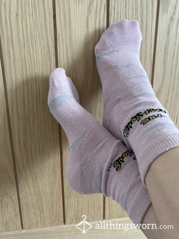 Embrace The Adventure: Well-Worn Pink "The Simpsons" Socks, Infused With Dust And Dirt