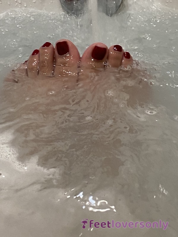 Feet Under Running Water In Bath