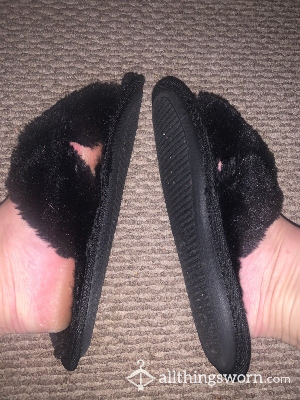 Fuzzy Black Slippers With Worn Soles