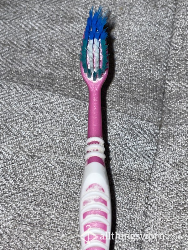 Heavily Used Pink Toothbrush