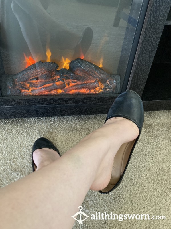 Little Black Flats Shoe Dangling In Front Of Fireplace Vid