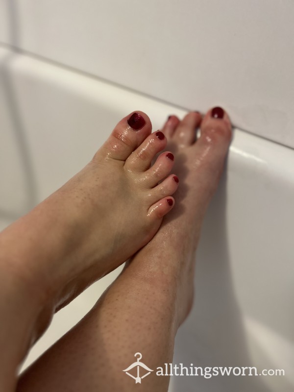 Oiling Tiny Feet That Have Red Nail Polish