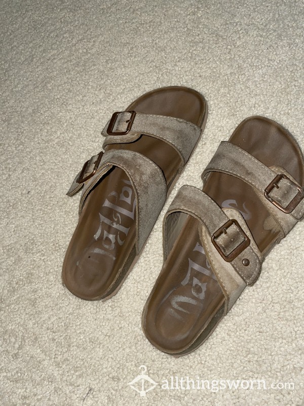 Old Worn Sandals With Toe Imprint