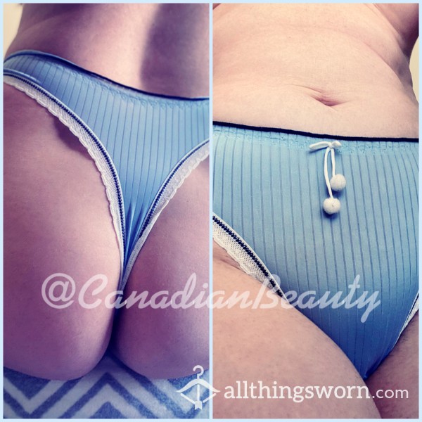 Silky Smooth Icy Blue Thong With Small White Fuzzy Pom Poms