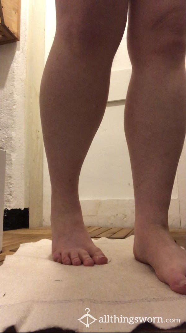 Undressing Before A Shower. View From The Floor Of Feet And Legs.