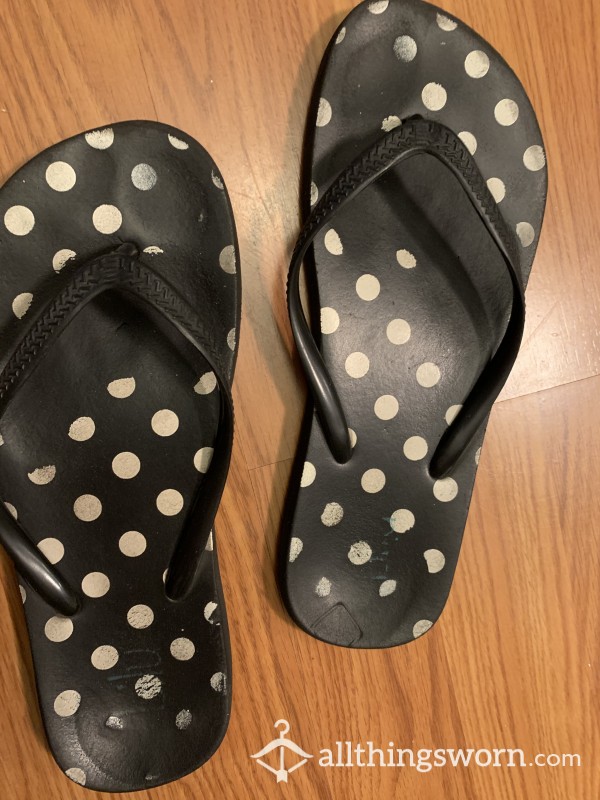 Very Well-worn Flip Flops With Deep Foot Imprints