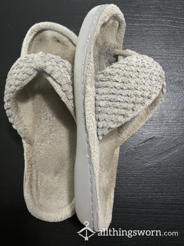 Well Used Slippers With Toe Prints