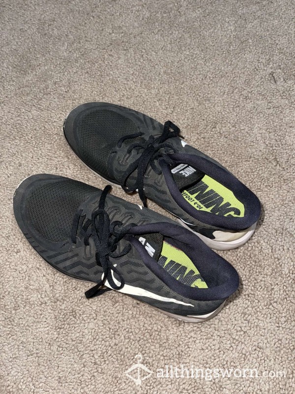 Well-worn Black Nike Running Shoes