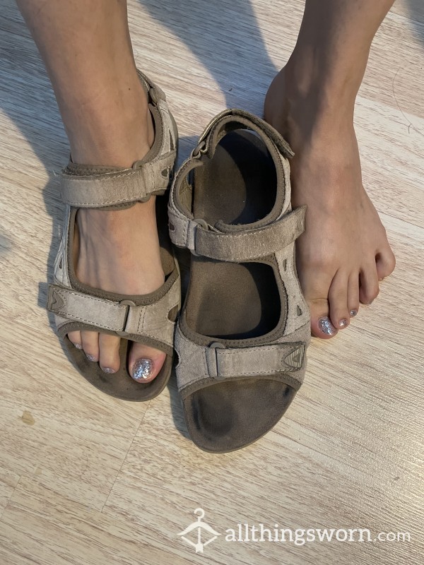 Well-worn Khaki Sandals With Foot Prints