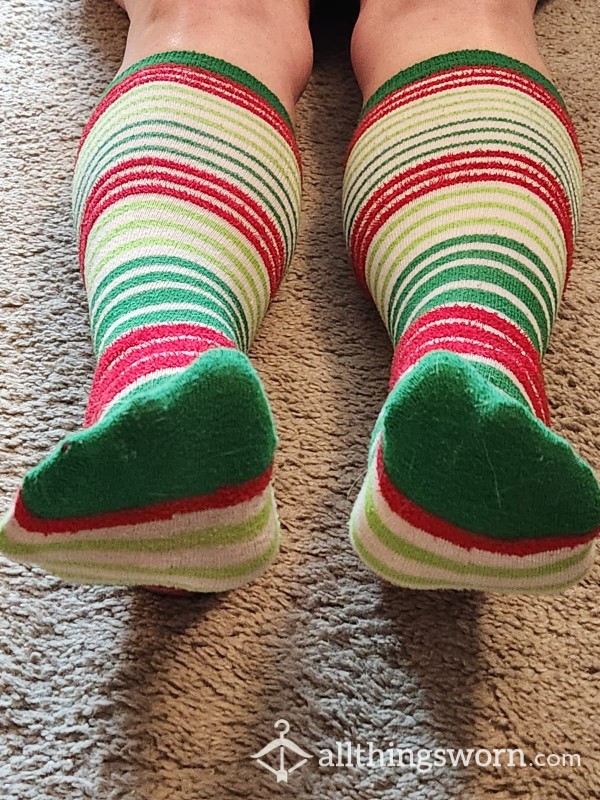 Well-worn, Striped Knee-high Christmas Socks.