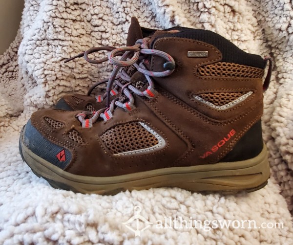Worn And Muddy Vasque Hiking Boots