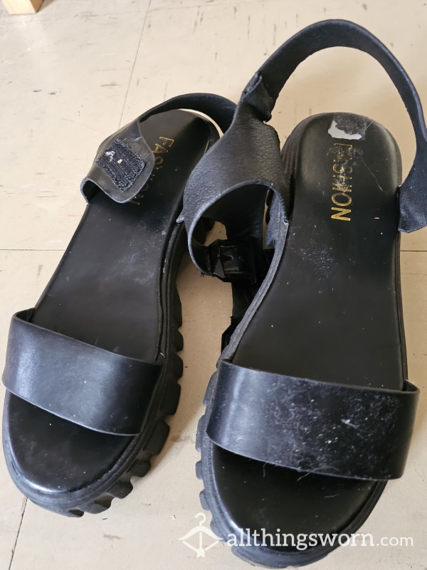 Worn Black Sandals