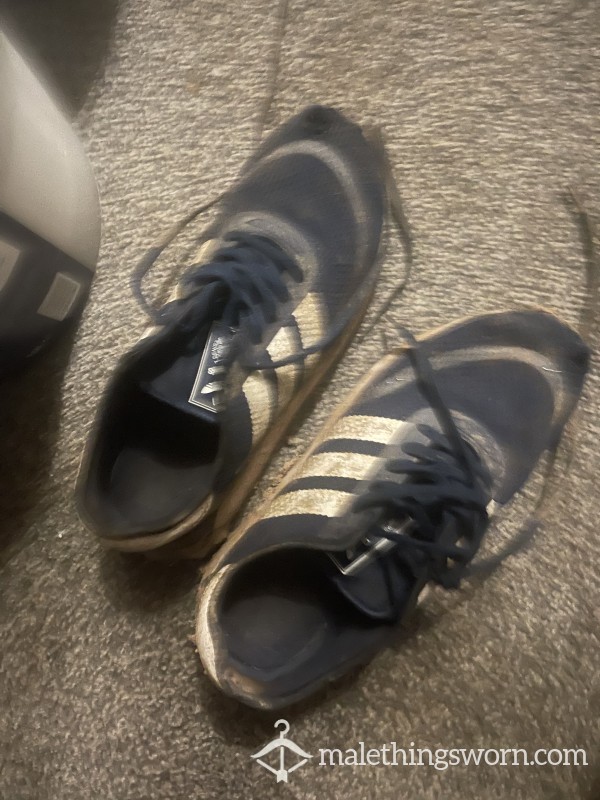 Worn Out Adidas Trainers.