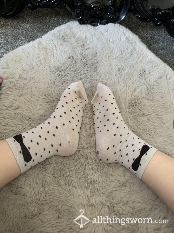 Worn Out White Polka Dot Socks With Holes