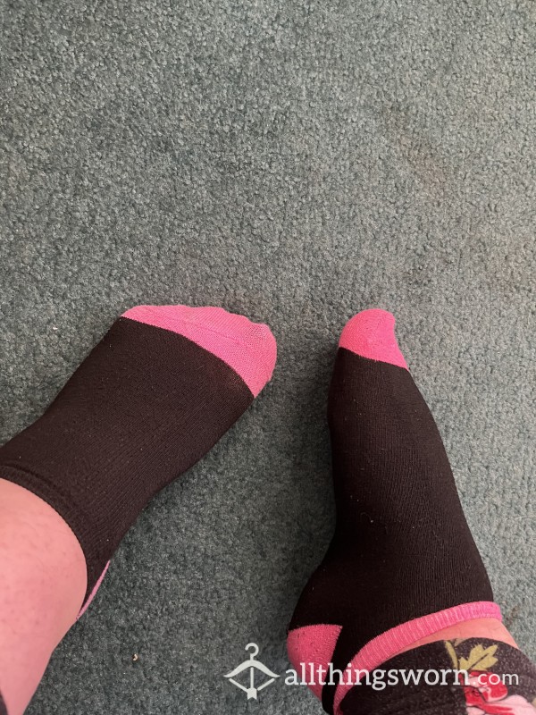Worn Pink And Black Socks
